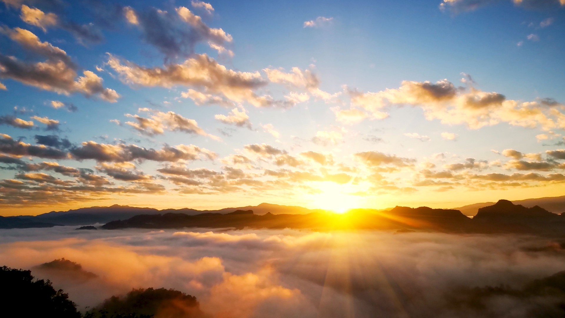 Scenic view dramatic beautiful sunset sky. Natural Sunset Sunrise on meadow silhouette shadow dark land. Vibrant dramatic sky on sunset, dawn, sunrise in Countryside. Landscape Colorful Sky At Sunset
